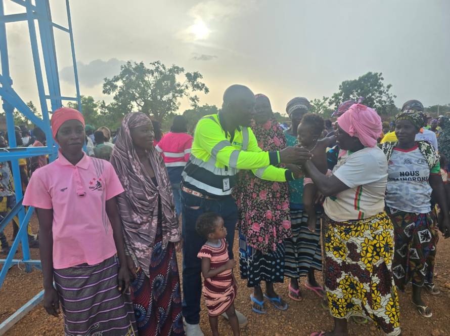 Residents of Dangona, Burkina Faso, gather at their new borehole during its inauguration